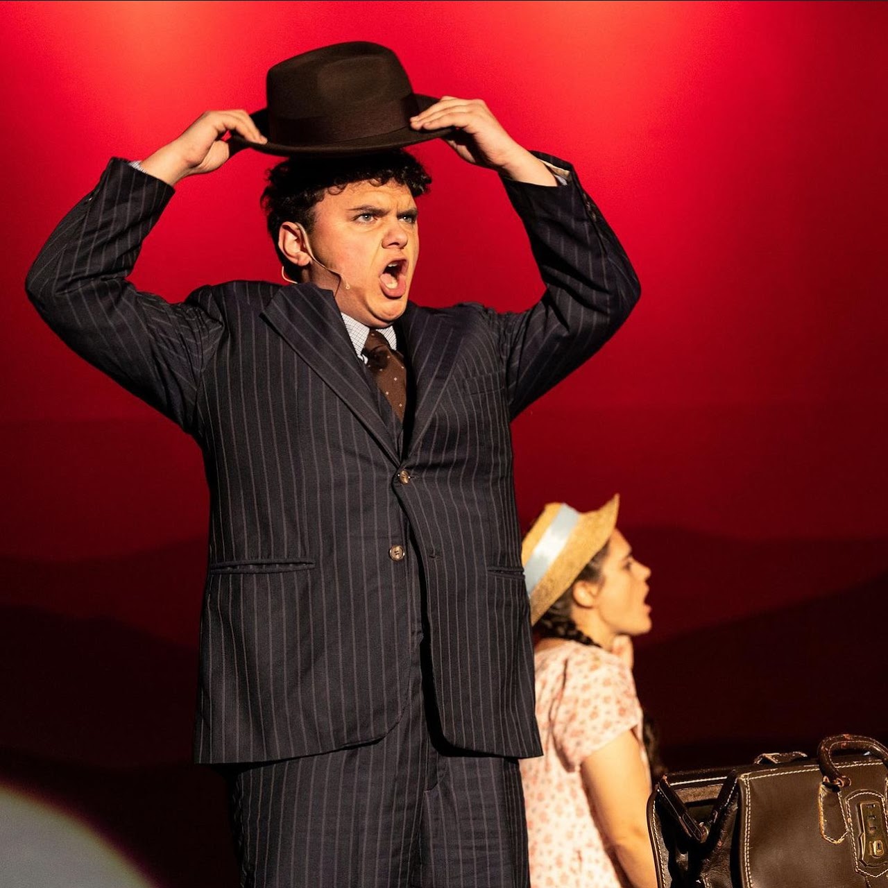 Colton acting in a theatrical production